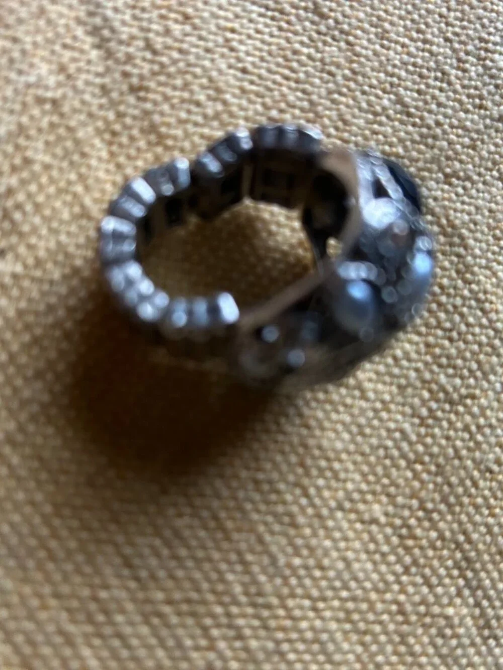Vintage style sliver-tone dome cocktail ring featuring an intricate cluster of